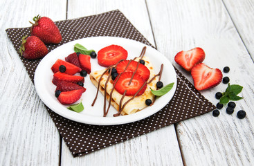 crepes with strawberries and chocolate sauce