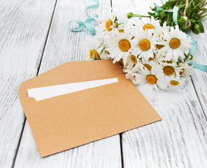 bouquet of daisies with envelope