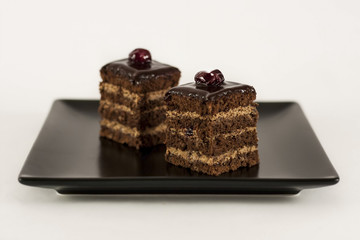 Square Cherry Cake on black square plate
