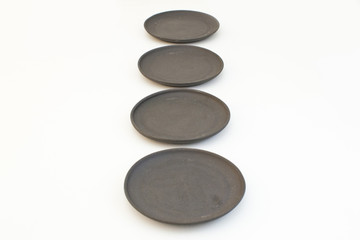 Small ceramic Japanese plates, Oriental ware on a white background