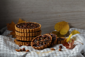 Fototapeta na wymiar Autumn delicious cakes with nuts on plate.