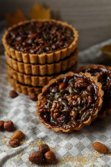 Autumn delicious cakes with nuts on plate.