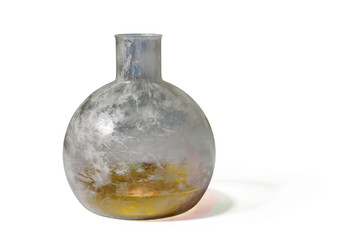 grungy laboratory glassware filled with golden liquid