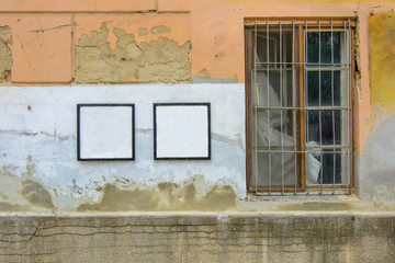 blank frame on a cracked concrete vintage brick wall background with old window 