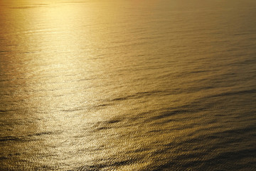 Waves sparkling in the light of the evening sun.