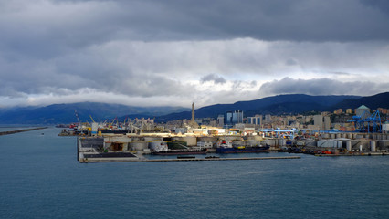 Fototapeta premium Port and the Lighthouse of Genoa in a cloudy day.