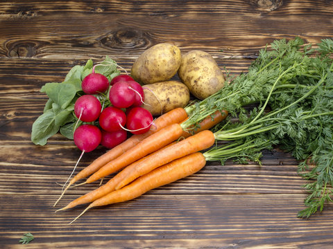 Fresh vegetables on a wooden background. 