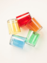 set of colorful glasses on white background