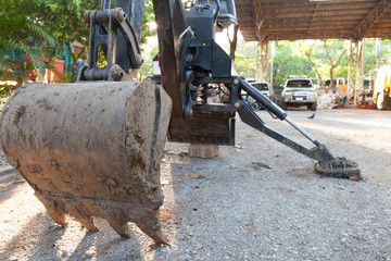 Excavator mini, have hydraulic stand on ground in site.