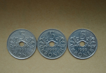 Norwegian kroner on craft background