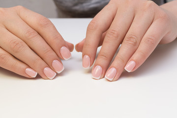 Attractive women's hands. Natural nails with beautiful manicure.