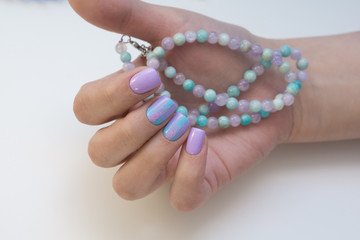 Attractive women's hands. Natural nails with beautiful manicure.