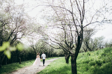  Loves and very happy groom and bride in the park