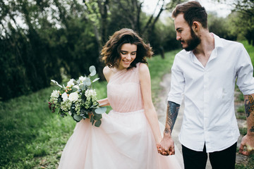  Loves and very happy groom and bride in the park