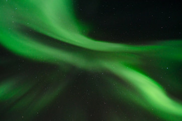 The Aurora in the sky at night .