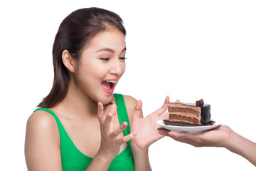 Beautiful smiling asian young woman with a chocolate cake isolated on white background.