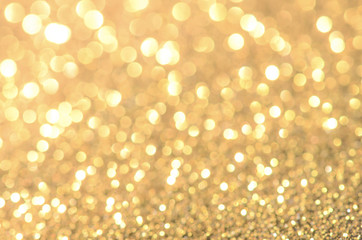 Gold abstract background with bokeh.