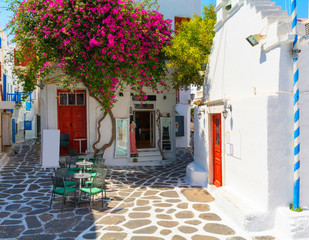 whitewashed narrow street in Mykonos island, Cyclades, Greece