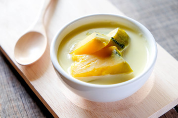 Thai style dessert, pumpkin sliced in sweet coconut milk.