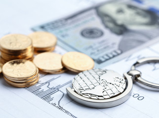 Coins, paper money and globe on white Statistic form background
