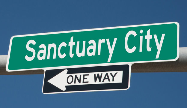 A 3d rendering of of a highway sign for Sanctuary City, one way