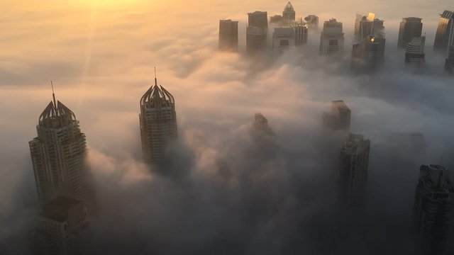 Early morning winter fog blanketing Dubai in winter. Dubai, UAE.