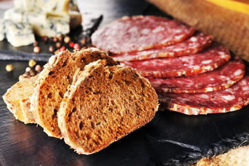 Fresh bread and sliced sausages on the table