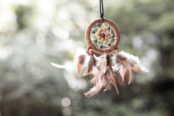 Soft focus on Dream Catcher with natural background in vintage style. Native american dream catcher. boho chic, ethnic amulet.