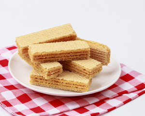 Wafers with cream  on white dish