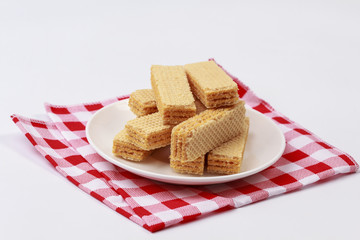 Wafers with cream on white dish