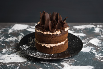Chocolate cake on the rustic background. Selective focus.