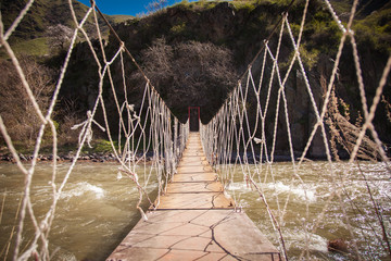 Rope bridge in the mountains - 146744913