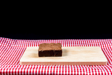 Chocolate Brownie cake on a dark plate