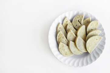 Steamed Vietnamese Pork Sausage sliced on a white dish with copy space