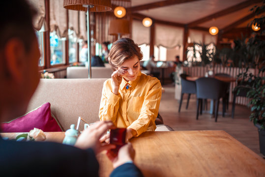 Marriage Proposal With Wedding Ring At Restaurant