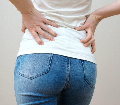 Woman having pain in her back.