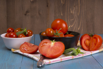 Fresh tomatoes on rustic wooden background