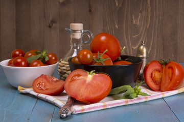 Fresh tomatoes on rustic wooden background