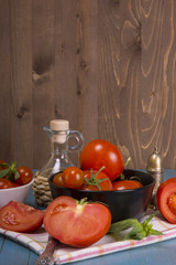 Fresh tomatoes on rustic wooden background