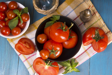 Fresh tomatoes on rustic wooden background