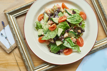 Mixed salad with chicken breast, bacon and fresh vegetables dressed yoghurt mustard sauce