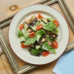 Mixed salad with chicken breast, bacon and fresh vegetables dressed yoghurt mustard sauce