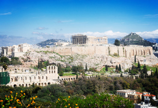 Famous skyline of Athens with Acropolis hill, Pathenon, Herodes Atticus amphitheater and Lycabettus Hill, Athens Greecer, retro toned