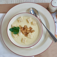 Cheese cream soup with baked apple and toast bread
