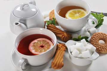  light breakfast in white ceramics with light tea with cookies