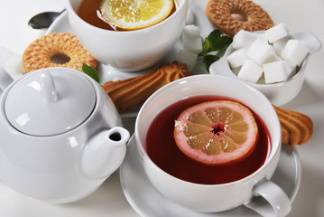 Delicious light breakfast in white ceramics with light tea with cookies