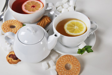 Delicious light breakfast in white ceramics with light tea with cookies