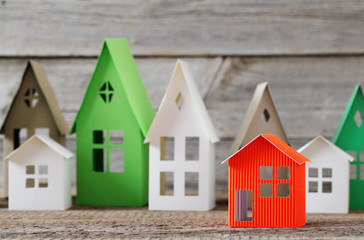 paper house on wooden background
