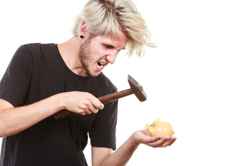 Sreaming man trying break piggy bank with hammer © anetlanda