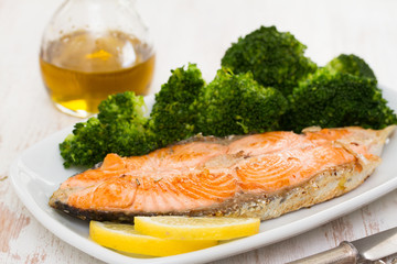 fried salmon with broccoli on dish